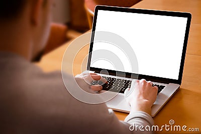 Man using laptop computer in living room Stock Photo