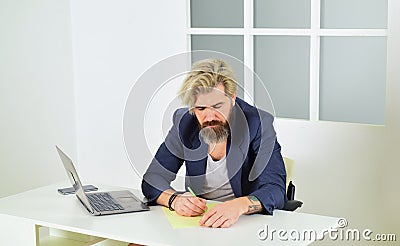 Man using laptop indoor. bearded man looking at his laptop screen. making business at home. e-commerce and shopping Stock Photo