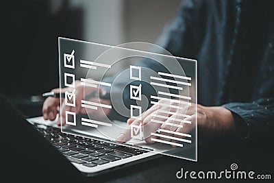Man using laptop questionnaire with checkbox, survey form online, answer questions in the exam of test business checklist and Stock Photo