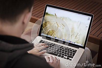 Man using Macbook pro retina Editorial Stock Photo