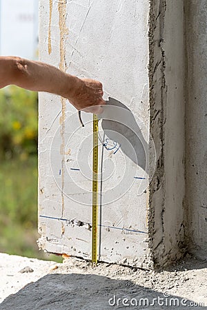 Man using measurement in element of window opening size Stock Photo
