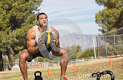 Man Using Medicine Ball Stock Photo