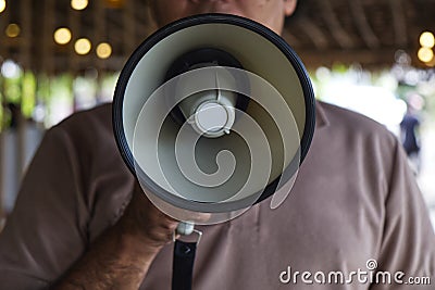 Man Using a Megaphone to Proclaim or Announcement Something with Very Loud Voice Stock Photo