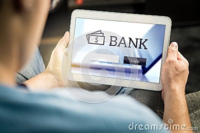 Man using mobile bank application with tablet. Stock Photo