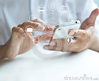 Man using mobile payments, holding circle global and icon customer network connection, Omni Channel Stock Photo