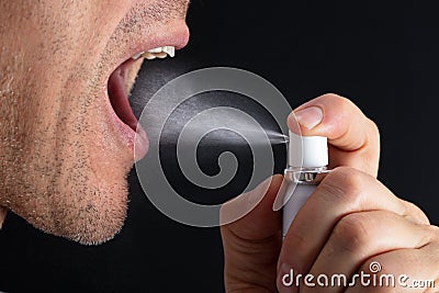 Man Using Mouth Freshener Stock Photo