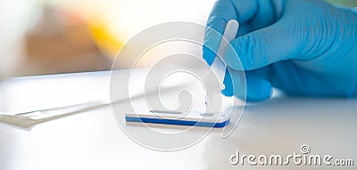 Man using a rapid antigen test kit. Rapid antigen testing is a screening tool to help to detect Corona COVID-19 in people without Stock Photo