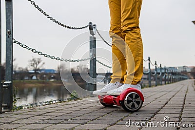 Man is using the red hoverboard Stock Photo