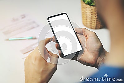 Man using smartphone for financial transactions. holding phone in hand Stock Photo
