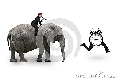 Man using speaker riding elephant after alarm clock Stock Photo