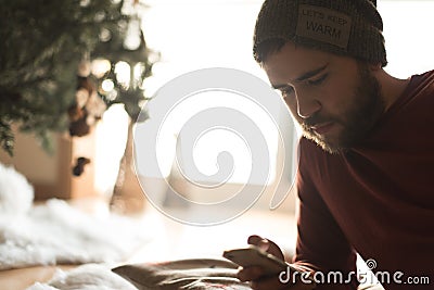 Man using a vaper and smartphone Stock Photo