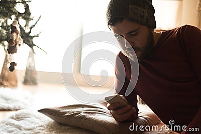 Man using a vaper and smartphone Stock Photo