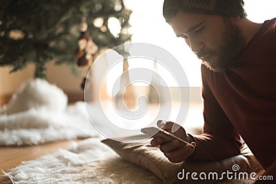 Man using a vaper and smartphone Stock Photo