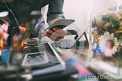 Man using VOIP headset with digital tablet computer docking keyboard,smart phone,concept communication, it support, call center Stock Photo