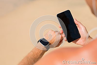Man using wearable tech during workout Stock Photo