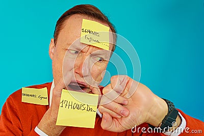 A man is very stressed by his hectic rhytm of life Stock Photo