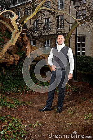 Man in Victorian clothing in the park Stock Photo