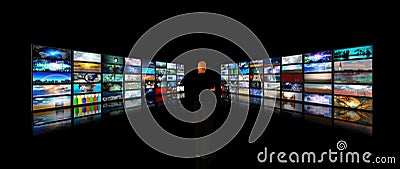 Man viewing video displays Stock Photo