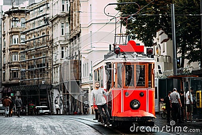 Man in a vintage tram on the Taksim Istiklal street in Istanbul. Man on public transport. Old Turkish tram on Istiklal street, Editorial Stock Photo