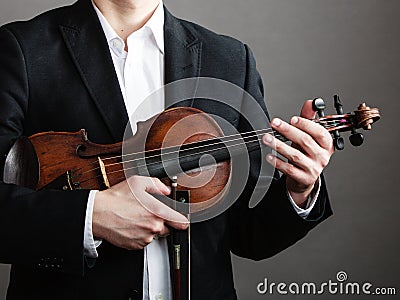 Man violinist holding violin. Classical music art Stock Photo