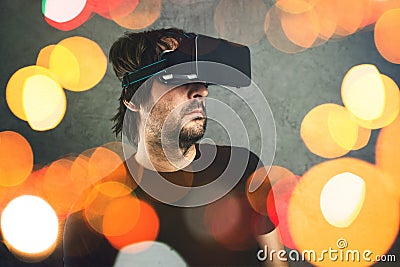 Man with virtual reality goggles enjoying 3d VR multimedia content Stock Photo