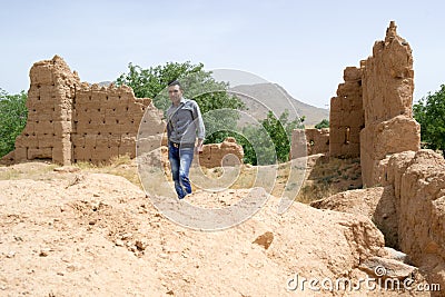 Man visiting a historical ruins site Stock Photo