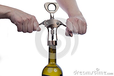 Man waiter opens a bottle of wine with corkscrew Stock Photo