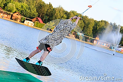 Man wakeboarding at lake Editorial Stock Photo