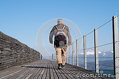 Man walking on the bridge of Rapperswil-Hurden Editorial Stock Photo