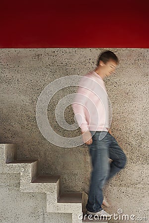 Man Walking Down Stairs Stock Photo