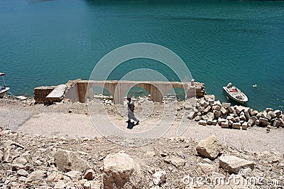 A man walking in Firat River Euphrates River Coastline Stock Photo