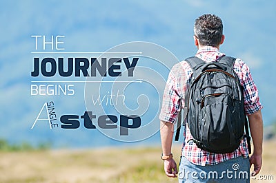 Man walking on mountain with inspirational quote Stock Photo