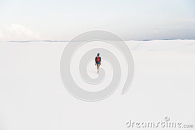 Man walking at White Sands National Monument in Alamogordo, New Mexico. Stock Photo