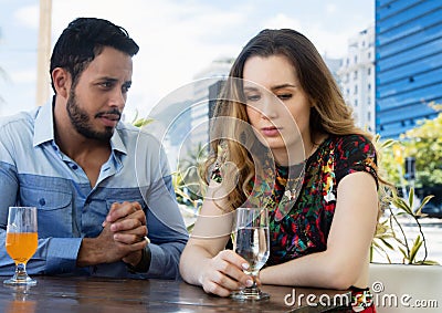 Man wants forgiveness from sad woman Stock Photo