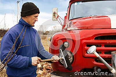 A man washes the old fire truck Stock Photo