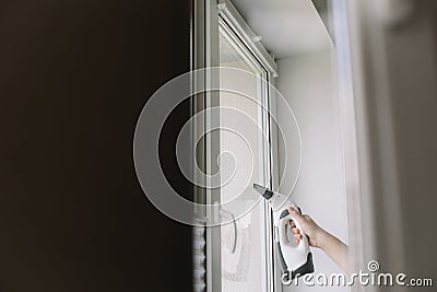 Man washing and cleaning window at home. Housework and housekeeping, home hygiene Stock Photo