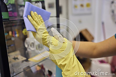 Man washing window in protective gloves closeup. Cleaning of apartments concept. Stock Photo