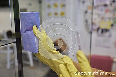 Man washing window in protective gloves closeup. Cleaning of apartments concept. Stock Photo