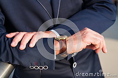 The man with the watch before meeting. Stock Photo