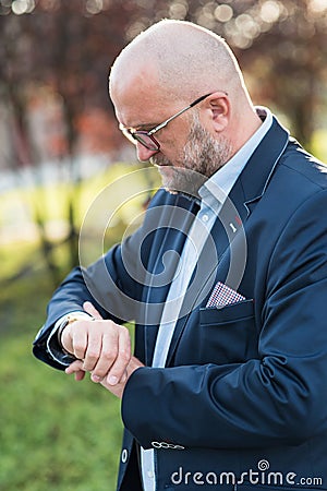 The man with the watch before meeting. Stock Photo