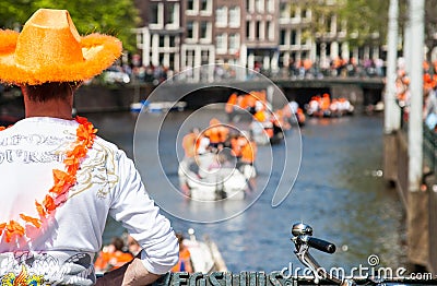 Man is watching boats - Koninginnedag 2012 Editorial Stock Photo