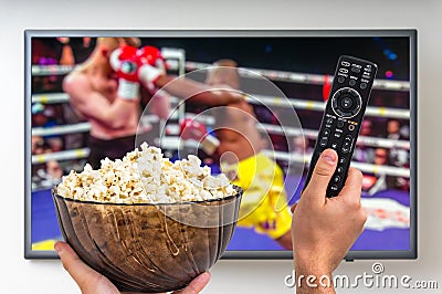 Man is watching boxing match on TV Editorial Stock Photo