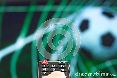 Man watching the football game in front of tv. Stock Photo