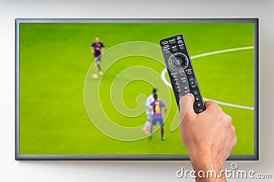 Man is watching football match on TV Editorial Stock Photo