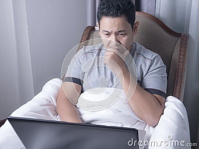 Man Watching Online Movie Streaming on Laptop Stock Photo