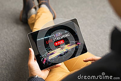 Man watching sports on live streaming online service Stock Photo