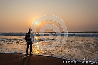 A man watching sunrise in sea beach from Digha popular spot of westbengal Stock Photo