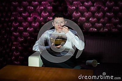 Man watching TV Stock Photo