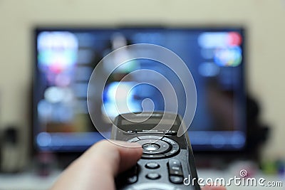 a man watching TV Stock Photo