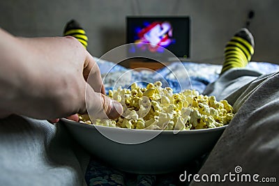 Man watching TV Stock Photo